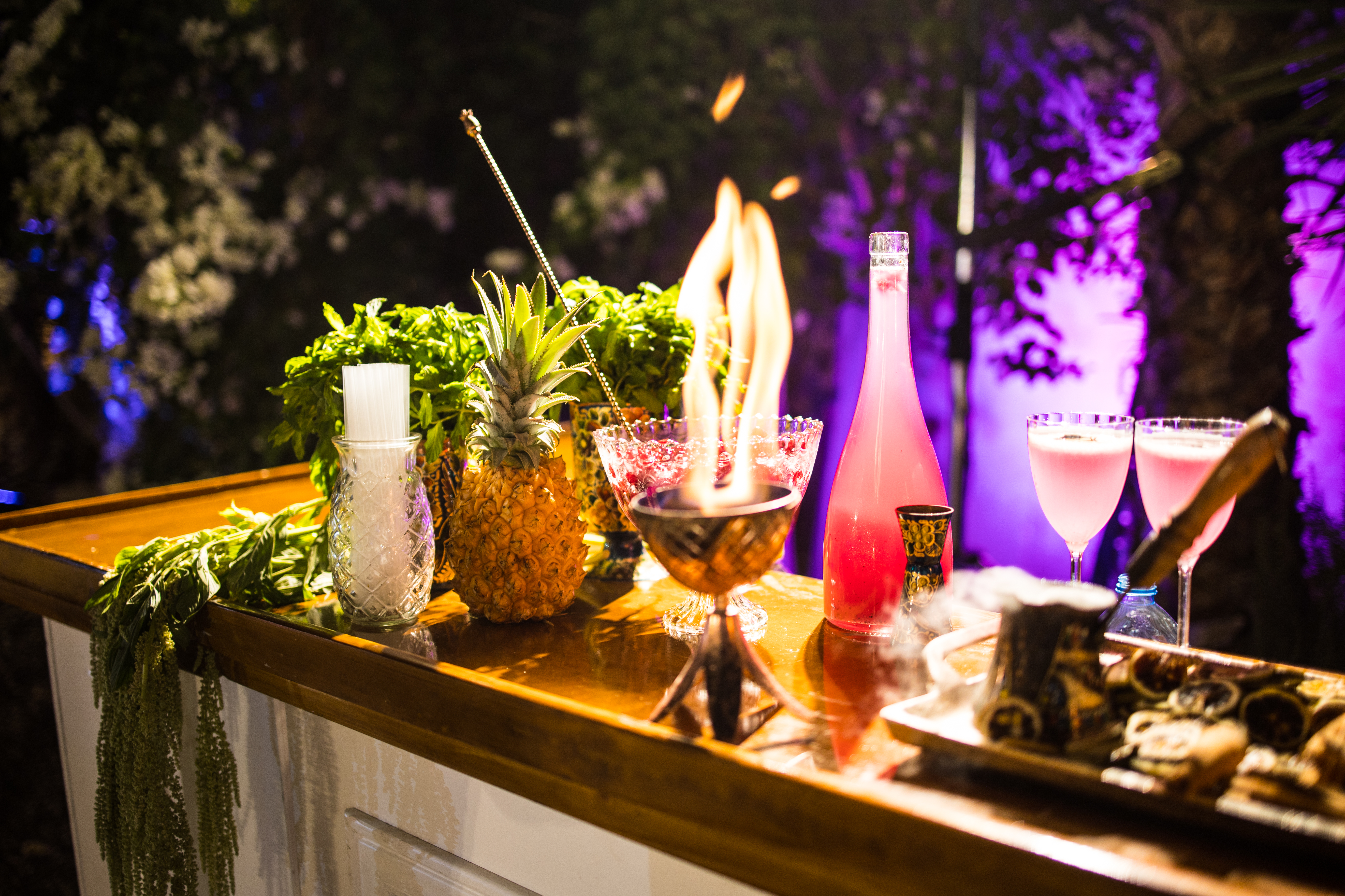 An event bar with a flaming cocktail
